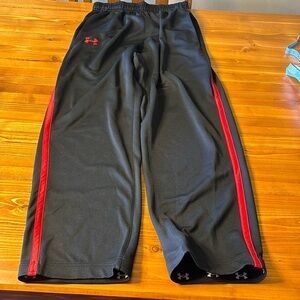 Men’s size medium loose fitting track pants. Black with red stripe and logo.